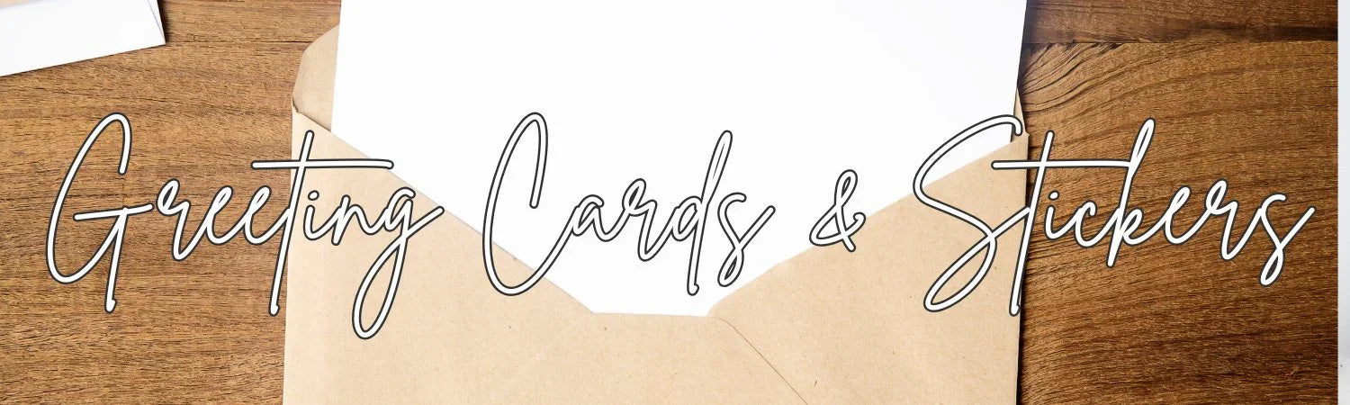 Brown kraft envelope with white card on wooden surface, text Greeting Cards & Stickers