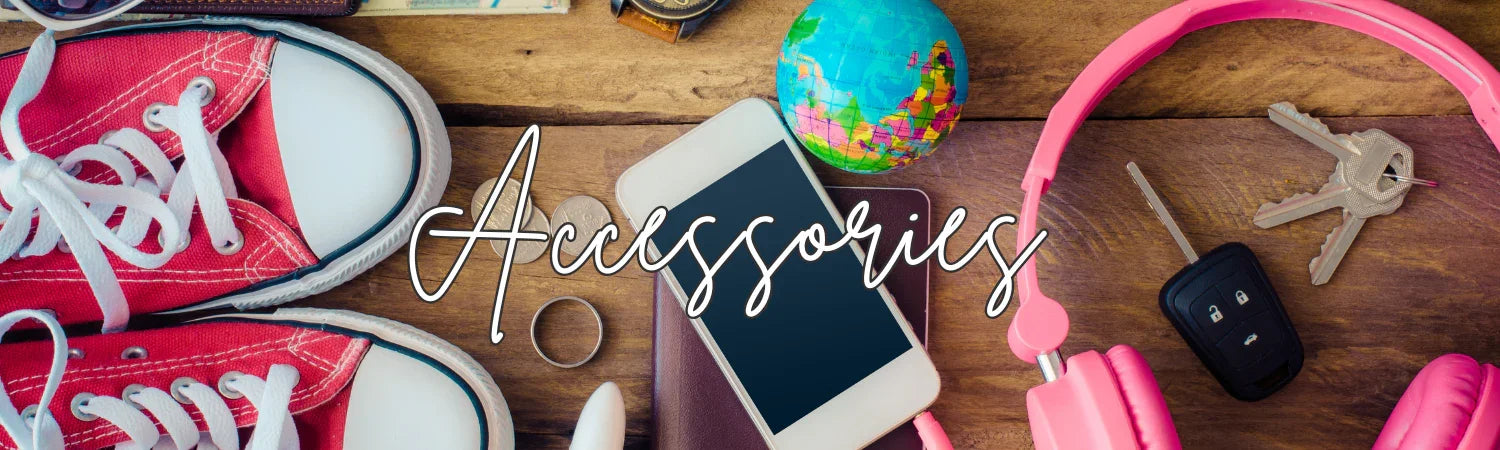 Red sneakers, smartphone, miniature globe, keys, and pink headphones on wooden surface with 'Accessories' text