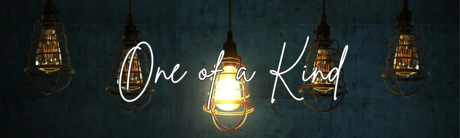 Industrial cage pendant lights glowing against a dark wall with 'One of a Kind' text overlay